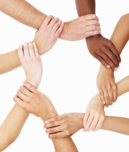 hands held together in a circle, symbolizing unity or togetherness
