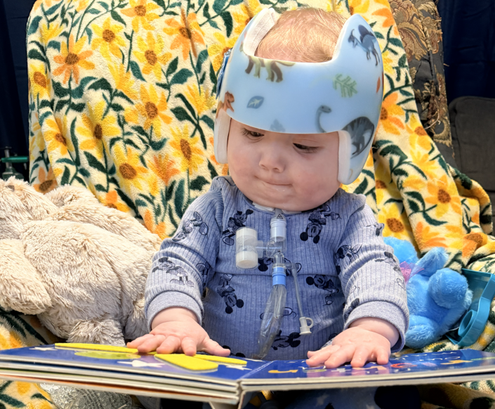young child reading a book