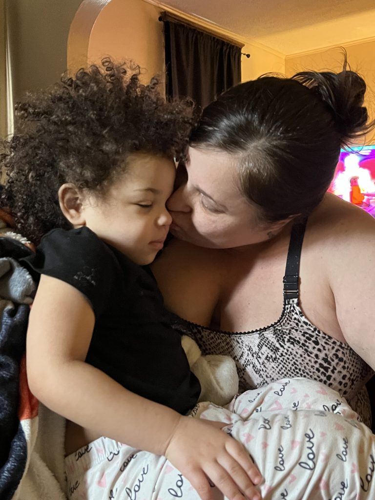 A mother lovingly holding her child