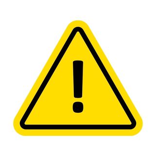 Triangular yellow caution sign with an exclamation point in the middle